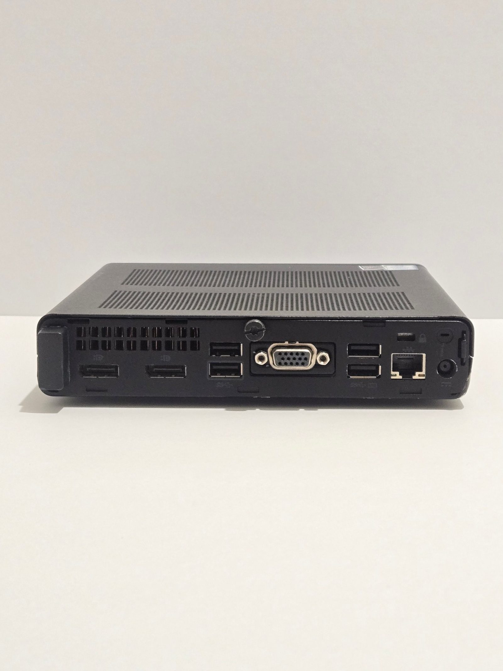 Back of the HP EliteDesk 800 G4 Mini showing its network, USB, DisplayPort and VGA ports